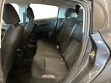 the back seats of a car with the door open in a car