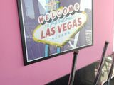 a picture of a welcome sign on the wall of a diner