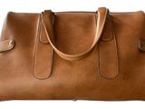 brown leather handbag on white background with clipping for text