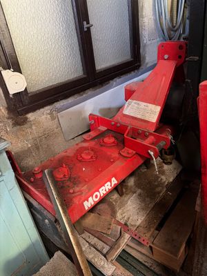 a red machine that is sitting in the corner of a room