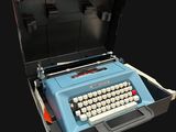 a blue typewriter in a black case on a black background