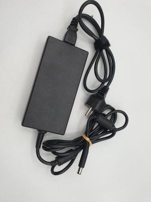 a black charger and cord on a white surface