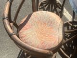 three chairs and a table in a parking lot