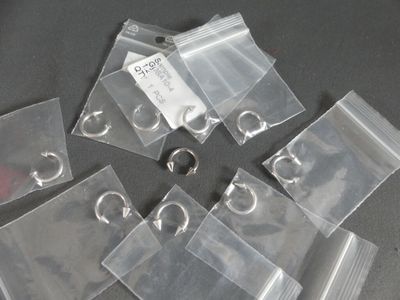 a lot of clear bags with a keychain on them