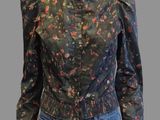 a mannequin mannequin wearing jeans and a floral blouse