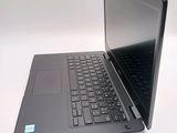 a laptop that is open on a white surface