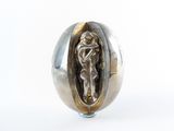 a close up of a silver ring with a jesus on it