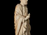 an antique statue of a man with a beard and a robe
