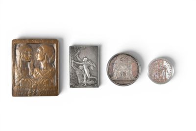 four different types of metal and wood stamps on a white surface