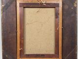 an old picture frame with a rope hanging from it ' s side