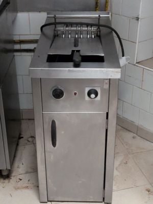 an image of a kitchen with a stove and a sink