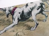 a drawing of a dog laying on the ground with a frisbee in it ' s mouth