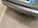 a close up of a car with a license plate on it ' s bumper