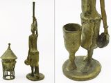 two pictures of a bronze statue of a man and a woman