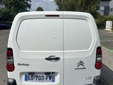a white van that is parked in a parking lot