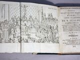 an old book with a drawing on it that is open