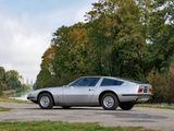 a silver sports car parked on the side of the road