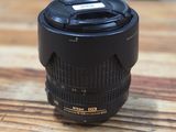 a close up of a camera lens sitting on a wooden table