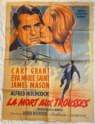 une vieille affiche de cinéma représentant un homme et une femme s'embrassant devant un avion