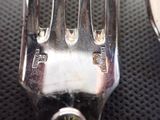 a fork and a spoon sitting on a table