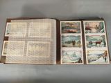 an open book with pictures of people and animals on it