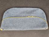a gray and yellow zippered pouch sitting on top of a table
