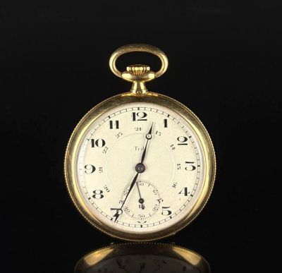 an image of a gold pocket watch sitting on top of a black surface