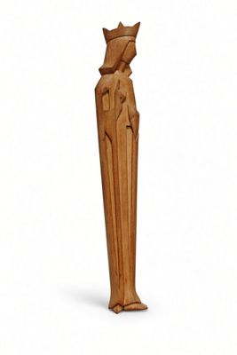 wooden statue of a woman with a crown on her head