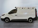 the white van is parked in a large room with a ladder on the roof
