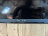 the sony laptop is sitting on top of a wooden table