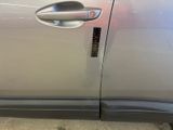 a close up of a car door handle with a sticker on it