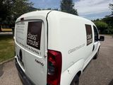 a white van that is parked in a parking lot