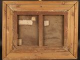 an old picture frame with a picture of a man and a woman in it