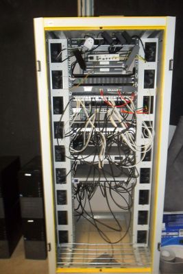 a rack with wires and wires in it in a room