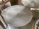 a glass display case with plates and plates on it