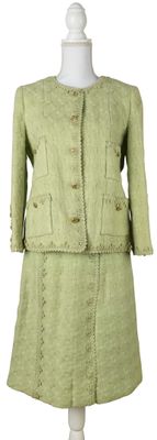 an image of a green dress and jacket on a mannequin