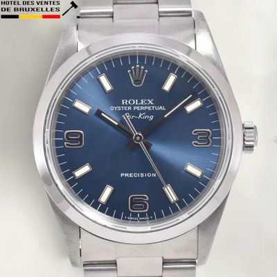 a watch that has a blue dial on it