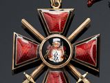 a red and gold cross with a picture on it