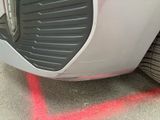 a close up of a car ' s tire with a red line painted on it
