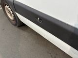 a white van parked on the side of the road