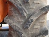 a large tire on the back of a tractor