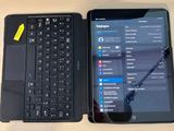 a laptop and a tablet sitting on a desk