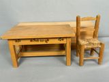two wooden chairs and a table with a chair next to it
