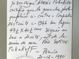 a handwritten letter on a piece of paper on a table