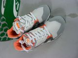 a pair of shoes that are next to a can of soda