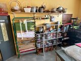 a room that has a bunch of items on the shelves