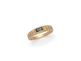 an 18k gold ring with a sapphire and diamonds