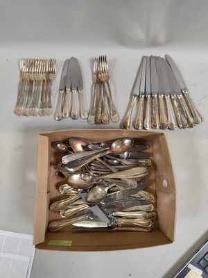 a box full of silverware on a table