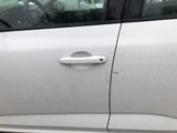 a white car with a sticker on the side of it