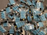 a pile of blue and black medical gauzes on a table